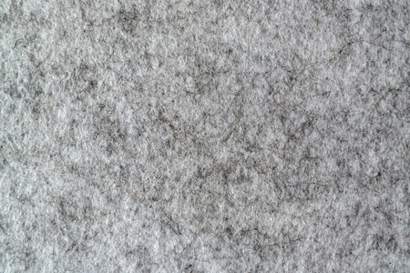 The material is felt. Felt texture. Gray wool fabric. Dense fleecy material. Valinok texture background.の写真素材