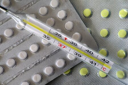 colds temperature. thermometer and pills. a course of treatment. medical preparations. heat. medical...
