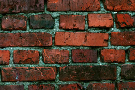 background old brickwork from red destroyed bricksの写真素材