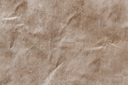 background yellow thick paper close-up. texture of a thick cardboard paper bagの写真素材