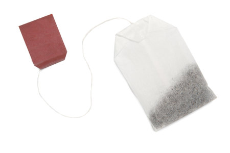Tea bag with rope and red tag top view isolate on white background close-upの写真素材