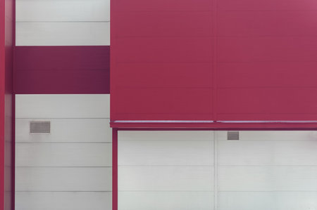 Warehouse facade cladding red and warm milky color geometric backgroundの写真素材