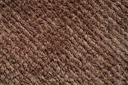 Fibers brown terry cloth close up backgroundの写真素材