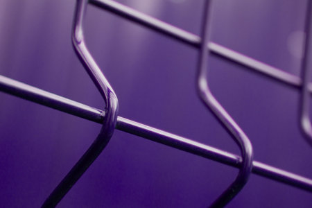 background abstraction curved metal bars in neon light. Table site curved fence rods in follet tonalityの写真素材