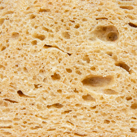 porous bread golden texture. yeast bread material porous coarseの写真素材