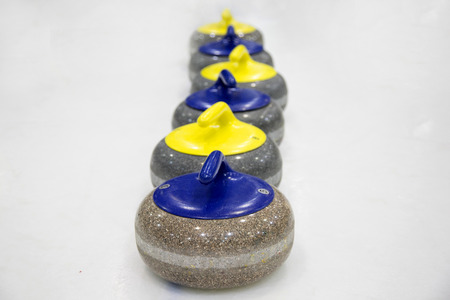 The stones for game in curling on iceの写真素材