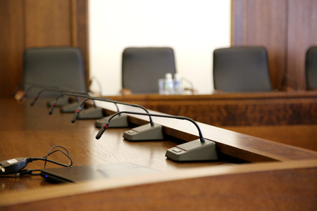 Microphones on the brown table in conference room