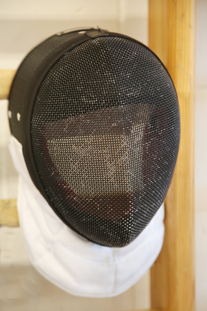 Fencing mask with the traditional fine wire mesh covering to protect the fencers faceの写真素材