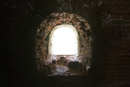 light in the window in ancient  fortressの写真素材
