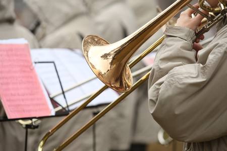 Trumpet with ttrombone play in orchestra outdoorの写真素材