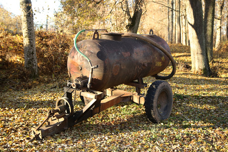old tank on wheels at autumn timeの写真素材