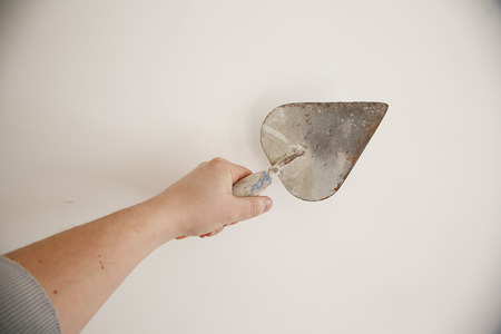 Man hold in the hand tools - trowelの写真素材