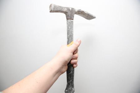 Man hold in the hand tools - hammerの写真素材