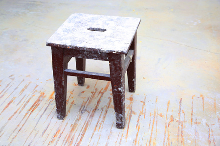 Dirty brown stool in the empty  roomの写真素材