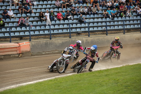 DAUGAVPILS, LATVIA - July 17, 2016. Speedway riders on the track. Semifinal of Team Speedway Junior European Championship. participants - Latvia, Denmark, Czech, Norway.