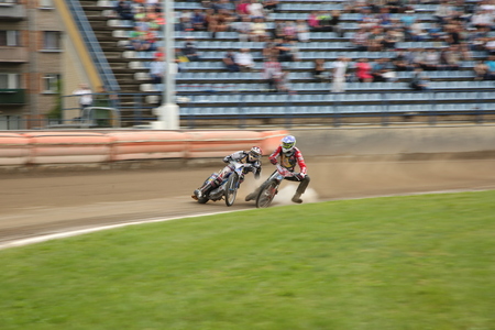DAUGAVPILS, LATVIA - July 17, 2016. Speedway riders on the track. Semifinal of Team Speedway Junior European Championship. participants - Latvia, Denmark, Czech, Norway.のeditorial素材