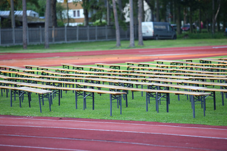 Rows of wooden benches on the stadiumの写真素材