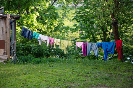 clothes hanging on a clothesline in the yardの写真素材