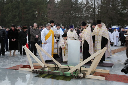DAUGAVPILS, LATVIA - January 19, 2015: Orthodox church Holy Epiphany Day. Weather -15. Priest...