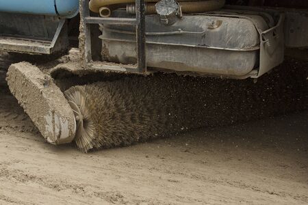 Brush on the sweeper rotates the streets cleaning dirtの写真素材