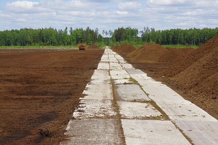 View of peat farm. Agriculture industry. Special roadの写真素材