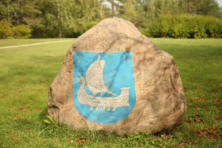 KRASLAVA, LATVIA - September 5, 2018 Sign at the entrance to the city with coat of arms of the city Kraslavaのeditorial素材