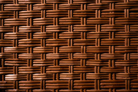 Hand-made textured basket. Wickerwork close-up. Backdrop for design ideas. Soft fokus.の写真素材