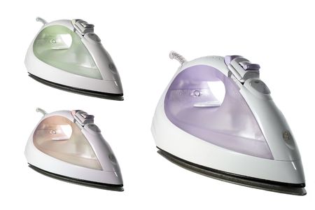 irons different colors on a white backgroundの写真素材