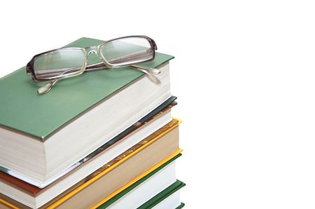 glasses are on the booksの写真素材