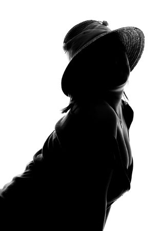 silhouette of the girl in the capの写真素材