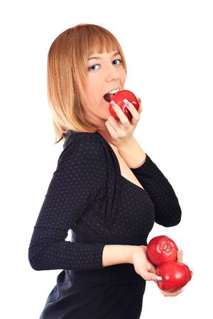 Attractive girl eating red apple. Studio shot.の写真素材