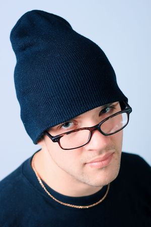 Serious man in glasses and hatの写真素材
