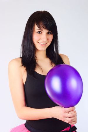 Girl with a purple balloonの写真素材