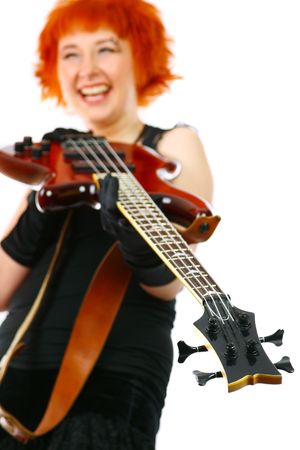 Young girl with a guitar on a white backgroundの写真素材