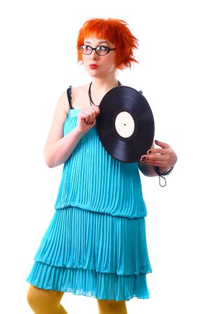 Young girl with a vinyl on a white backgroundの写真素材