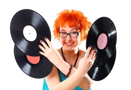 Young girl with a vinyl on a white backgroundの写真素材