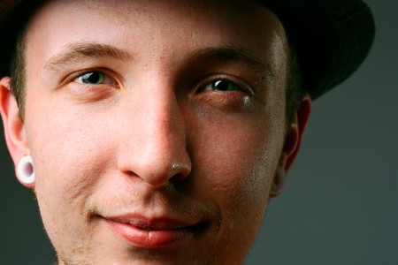 Close-up of a young man in hatの写真素材