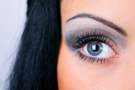 Close-up portrait of young woman with black hairの写真素材