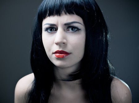 Young woman with red lips. Studio shot.の写真素材