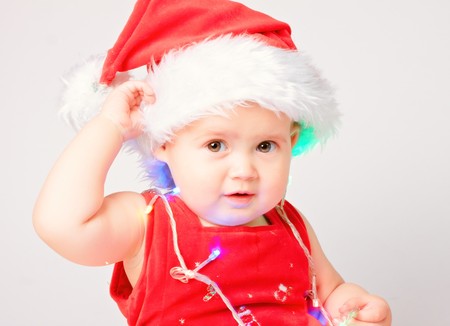 Baby in Santa Claus hat on white backgroundの写真素材