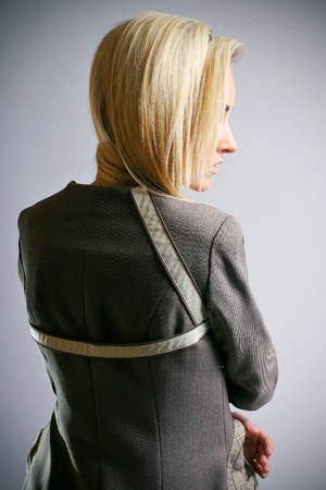 Beautiful model posing on grey backgroundの写真素材