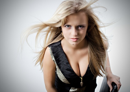 Portrait of a beautiful girl with flying hairの写真素材