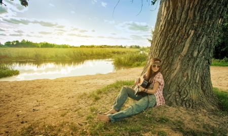 Beautiful hippie girl with guitar