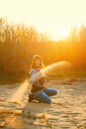 Woman in sunsetの写真素材