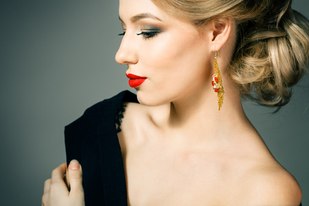 Beautiful blonde girl with a golden crownの写真素材
