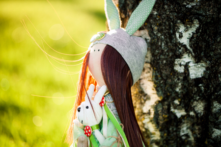 Funny dolls on green grassの写真素材