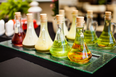 Bottles with different kinds of vegetable oilの写真素材