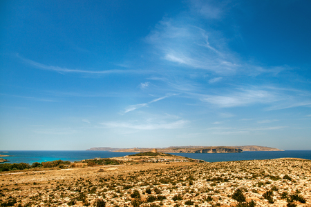Rocky Beach and Grotto with Blue water at Maltaの写真素材