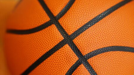 Closeup detail of orange basketball ball texture backgroundの写真素材