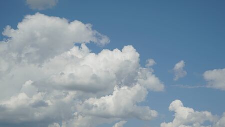 Blue sky with a clouds in a clear summer day backgroundの写真素材